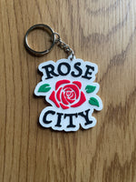 Load image into Gallery viewer, Rose City Rubber Keychain
